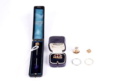 Lot 505 - A Victorian red stone and seed pearl ring; two other rings; a pin; and two dress studs