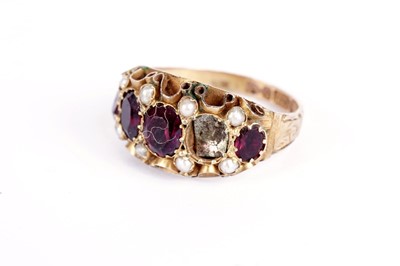 Lot 505 - A Victorian red stone and seed pearl ring; two other rings; a pin; and two dress studs