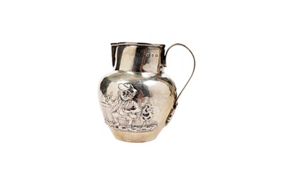 Lot 1453 - A George III embossed cream jug and another late Victorian jug