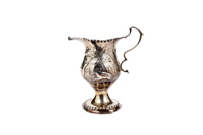 Lot 1453 - A George III embossed cream jug and another late Victorian jug