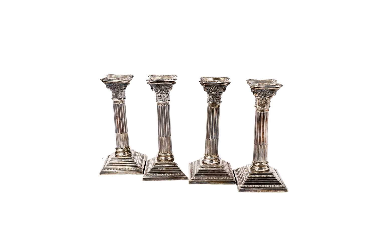 Lot 1326 - A set of four Elizabeth II dwarf candlesticks
