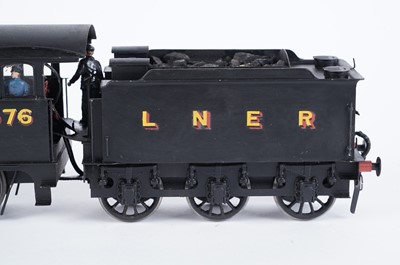 Lot 12 - A metal kit-built 0-gauge 0-6-0 locomotive and six-wheel tender