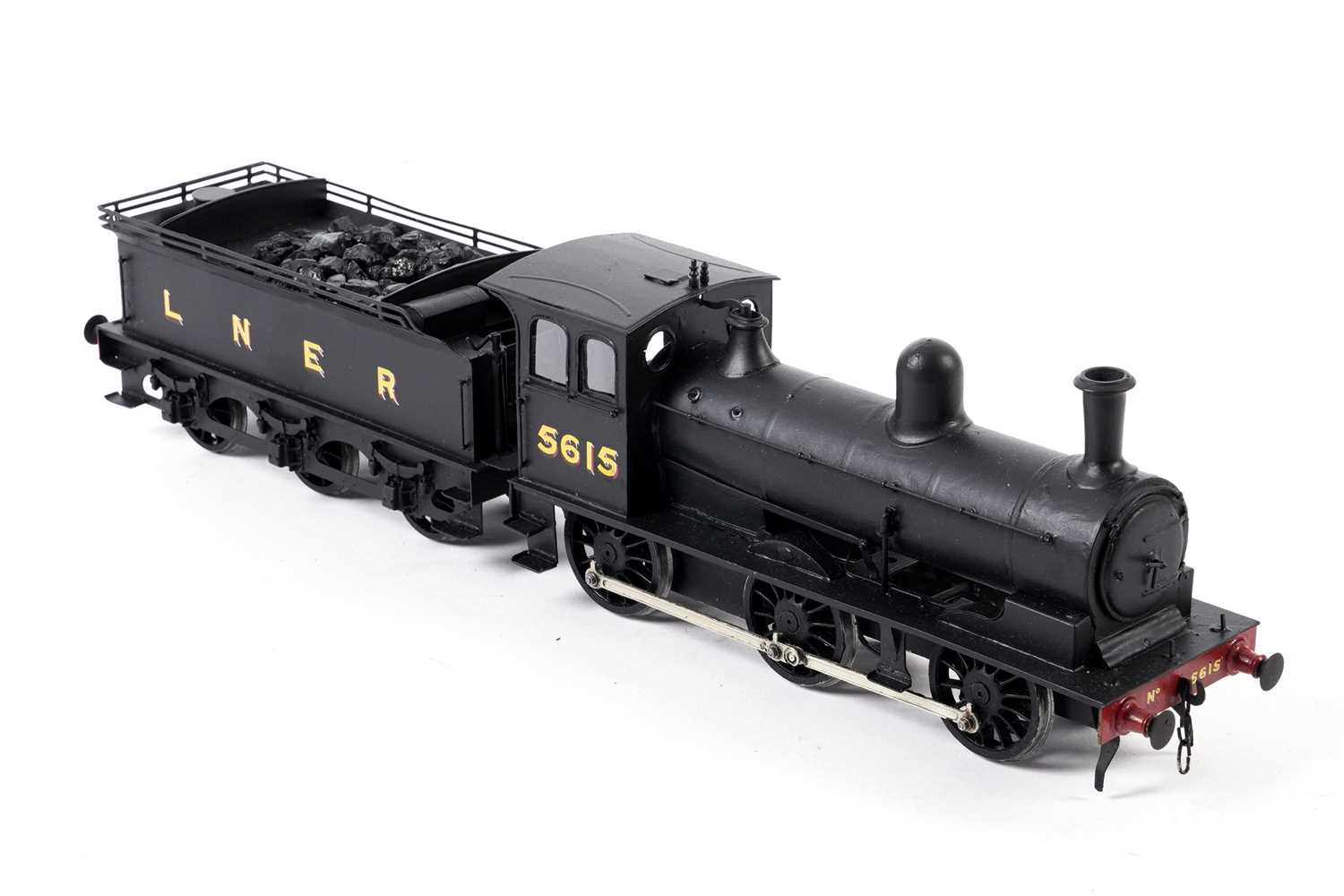 Lot 16 - A metal kit-built 0-gauge 0-4-2 locomotive and six-wheel tender
