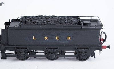 Lot 21 - A metal kit-built 0-gauge 0-6-0 locomotive and six-wheel tender