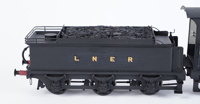 Lot 21 - A metal kit-built 0-gauge 0-6-0 locomotive and six-wheel tender