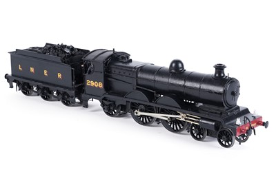Lot 24 - A metal kit-built 0-gauge4-4-2 locomotive and six-wheel tender