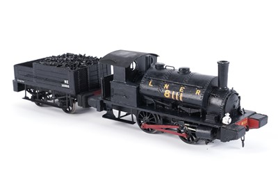 Lot 36 - A metal 0-gauge 0-4-0 locomotive and four-wheel tender
