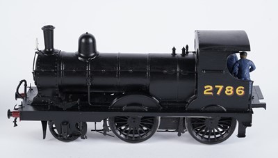 Lot 73 - A metal kit-built 0-gauge 0-6-0 locomotive and six-wheel tender