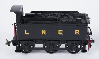 Lot 73 - A metal kit-built 0-gauge 0-6-0 locomotive and six-wheel tender