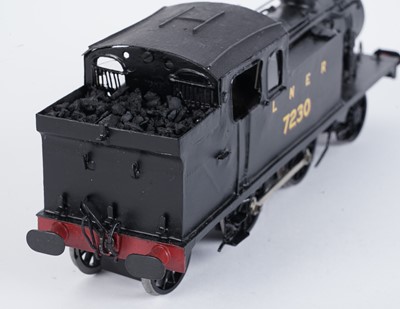 Lot 98 - A metal kit-built 0-gauge 2-4-2 locomotive