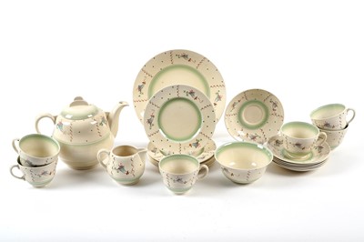 Lot 177 - A Clarice Cliff tea service, decorated with stylised flowers in blue and pink