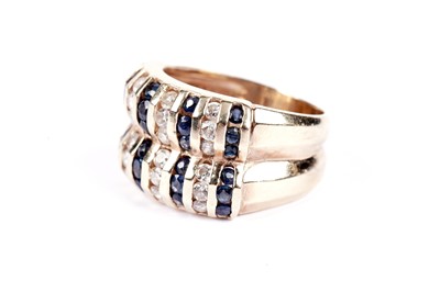 Lot 558 - A sapphire and diamond dress ring