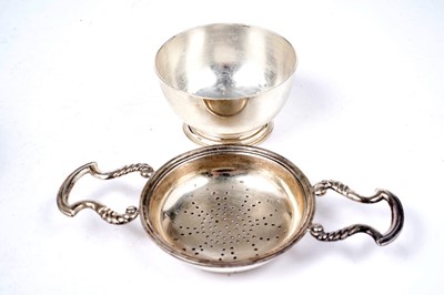 Lot 1339 - An Elizabeth II tea strainer and a peppermill