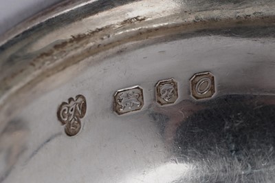 Lot 1339 - An Elizabeth II tea strainer and a peppermill