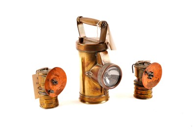 Lot 180 - Brass Ceag lamp and a pair of carbide lamps