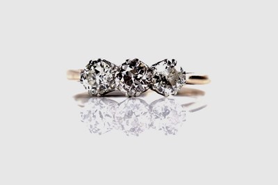 Lot 1151 - A three stone diamond ring