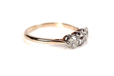 Lot 1151 - A three stone diamond ring
