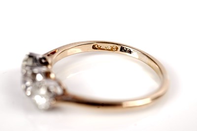 Lot 1151 - A three stone diamond ring