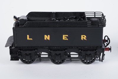 Lot 148 - A metal kit-built 0-gauge 0-6-0 locomotive and six-wheel tender