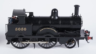 Lot 240 - A metal kit-built 0-gauge 2-4-0 locomotive and six-wheel tender