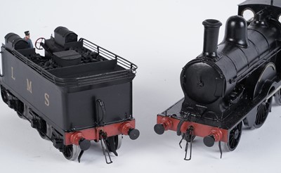 Lot 240 - A metal kit-built 0-gauge 2-4-0 locomotive and six-wheel tender
