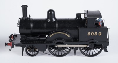Lot 240 - A metal kit-built 0-gauge 2-4-0 locomotive and six-wheel tender