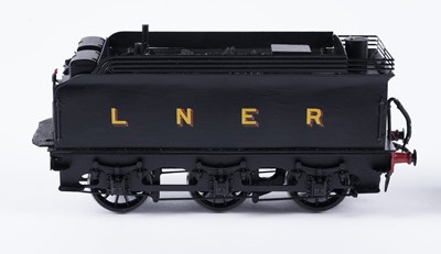 Lot 256 - A metal kit-built 0-gauge 4-4-0 locomotive and six-wheel tender