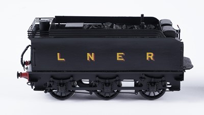 Lot 256 - A metal kit-built 0-gauge 4-4-0 locomotive and six-wheel tender
