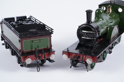 Lot 259 - A metal kit-built 0-gauge 4-2-2 locomotive and six-wheel tender