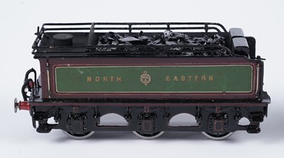 Lot 259 - A metal kit-built 0-gauge 4-2-2 locomotive and six-wheel tender