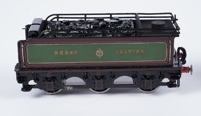 Lot 259 - A metal kit-built 0-gauge 4-2-2 locomotive and six-wheel tender