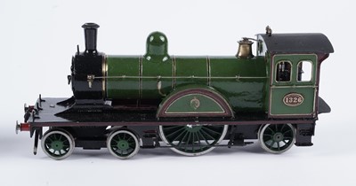 Lot 259 - A metal kit-built 0-gauge 4-2-2 locomotive and six-wheel tender