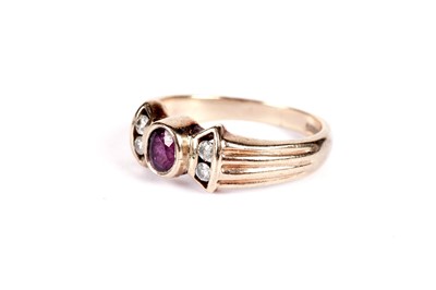 Lot 519 - A ruby and diamond dress ring