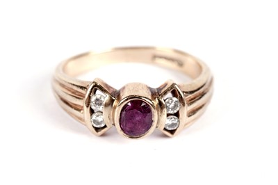 Lot 519 - A ruby and diamond dress ring