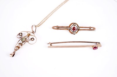 Lot 540 - An Edwardian peridot and seed pearl drop pendant; and two brooches