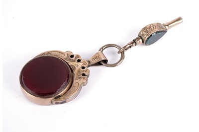 Lot 543 - A Victorian bloodstone and carnelian swivel fob; and a watch key