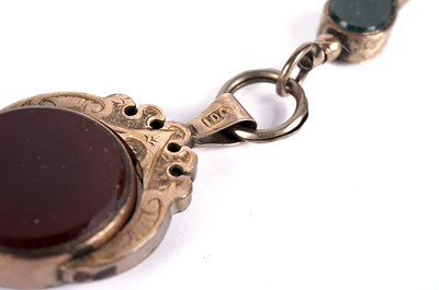 Lot 543 - A Victorian bloodstone and carnelian swivel fob; and a watch key
