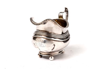 Lot 1429 - A late George III silver cream jug