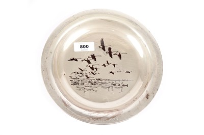 Lot 800 - A silver dish decorated by Peter Scott