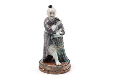 Lot 314 - A Chinese porcelain figure