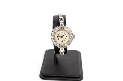 Lot 1003 - A diamond set platinum cased lady's cocktail watch
