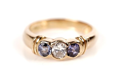 Lot 1083 - A diamond and tanzanite ring