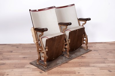 Lot 4 - A pair of early/mid-20th Century oak and cast metal cinema seats