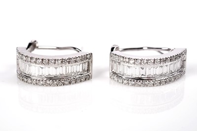 Lot 1257 - A pair of diamond hoop earrings