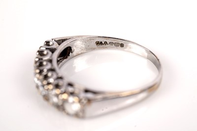 Lot 1090 - A six stone diamond ring