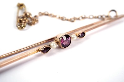 Lot 31 - A purple paste and seed pearl bar brooch
