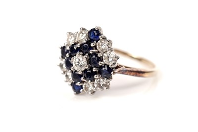 Lot 51 - A sapphire and diamond cluster ring