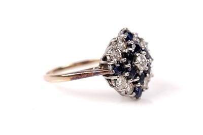 Lot 51 - A sapphire and diamond cluster ring