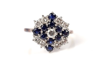 Lot 51 - A sapphire and diamond cluster ring