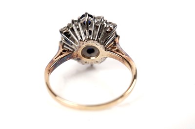 Lot 51 - A sapphire and diamond cluster ring